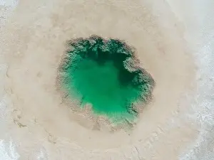 Alkaline Prints: Aerial view of the famous tourist attraction Ojos del Mar near Tolar Grande in the Argentinian highlands called Puna