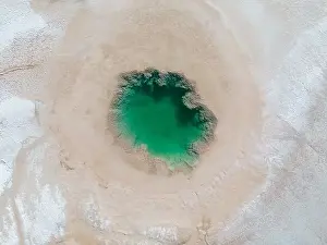 Salt Water Prints: Aerial view of the famous tourist attraction Ojos del Mar near Tolar Grande in the Argentinian highlands called Puna