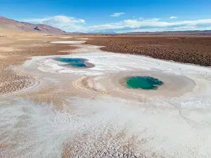 Alkaline Prints: Aerial view of the famous tourist attraction Ojos del Mar near Tolar Grande in the Argentinian highlands called Puna