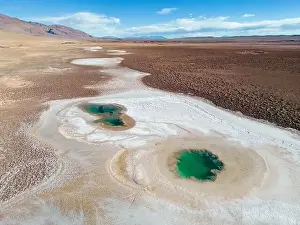 Alkaline Prints: Aerial view of the famous tourist attraction Ojos del Mar near Tolar Grande in the Argentinian highlands called Puna
