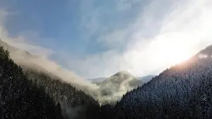 Snowscape Prints: Aerial view of foggy winter forest and sunrise in Low Tatras mountains of Slovakia
