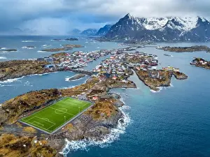 Creativity Prints: Aerial view of football field of Henningsvaer fisher village on Lofoten Islands in Norway