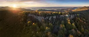 Aerial view of forest with red trees on mountain in fall in Slovakia