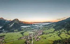 Swabia Prints: Aerial view of German Village Bad Oberdorf at sunrise near Zugspitze and austria border