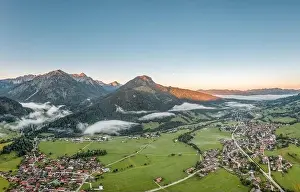 Swabia Prints: Aerial view of German Village Bad Oberdorf at sunrise near Zugspitze and austria border