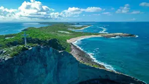 Pointe Prints: Aerial View to the Green Coast of the Pointe des Chateaux beach under the blue cloudy sky
