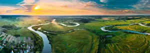 Aerial View Green Forest Woods Meadow And River Landscape In Sunny Spring Evening. Top View Of Beautiful European Nature From High Attitude In Summer