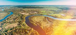 Aerial View Green Forest Woods And River Landscape In Sunny Spring Summer Day. Top View Of Nature, Bird's Eye View. Trees Standing In Water During