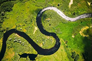 Aerial View Green Forest Woods And River Landscape In Sunny Spring Summer Day. Top View Of Beautiful European Nature From High Attitude In Autumn