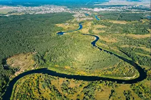 Aerial View Green Forest Woods And River Landscape In Sunny Summer Day. Top View Of Beautiful European Nature From High Attitude In Summer Season. Dro