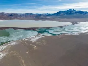 Green Lagoon Prints: Aerial view of the green and partly frozen Laguna del Negro Francisco in the Atacama desert in Chile - Traveling