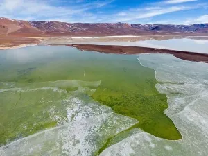 Off Road Prints: Aerial view of the green and partly frozen Laguna del Negro Francisco in the Atacama desert in Chile - Traveling