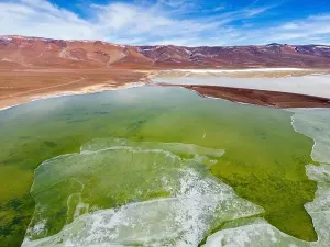 Off Road Prints: Aerial view of the green and partly frozen Laguna del Negro Francisco in the Atacama desert in Chile - Traveling