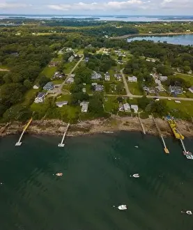 Residential District Prints: Aerial view of a Harpswell water front neighborhood and moored boats in the bay