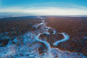 Heart Shaped Prints: Aerial view of a heart shaped winter forest with frozen river