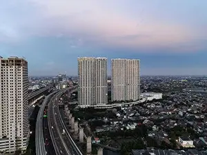 Interchange Prints: Aerial view of highway intersection and buildings in the city of Bekasi and noise cloud with Bekasi cityscape