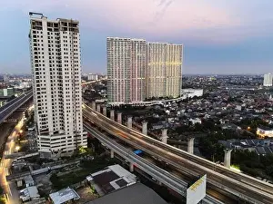 Interchange Prints: Aerial view of highway intersection and buildings in the city of Bekasi and noise cloud with Bekasi cityscape