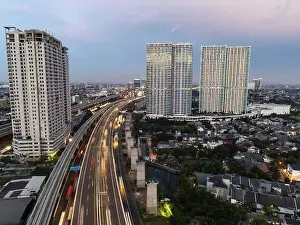 Interchange Prints: Aerial view of highway intersection and buildings in the city of Bekasi and noise cloud with Bekasi cityscape