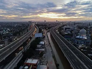 Interchange Prints: Aerial view of highway intersection and buildings in the city of Bekasi and noise cloud with Bekasi cityscape
