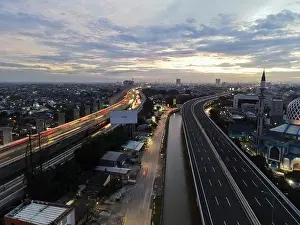Interchange Prints: Aerial view of highway intersection and buildings in the city of Bekasi and noise cloud with Bekasi cityscape