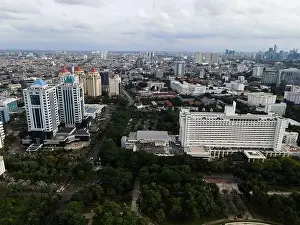 Interchange Prints: Aerial view of highway intersection and buildings in the city of Jakarta and noise cloud with Jakarta cityscape