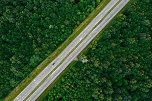 Flat View Prints: Aerial View Of Highway Road Through Green Forest Landscape In Summer