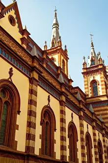 Architecture View Prints: An aerial view of a historic church featuring two large clock faces on either side of the large windows