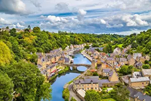 Cotes Darmor Prints: Aerial view of the historic town of Dinan with Rance river with dramatic cloudscape