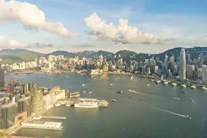 Aerial view of Hong Kong skyline and Victoria Harbor with blue sky in Hong Kong. Asia