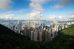 Aerial view of Hong Kong skyline and Victoria Harbor with blue sky in Hong Kong. Asia