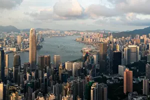Aerial view of Hong Kong skyline and Victoria Harbor with blue sky in Hong Kong. Asia