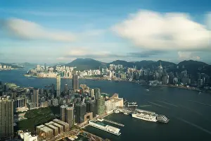 Aerial view of Hong Kong skyline and Victoria Harbor with blue sky in Hong Kong. Asia