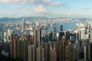 Aerial view of Hong Kong skyline and Victoria Harbor with blue sky in Hong Kong. Asia