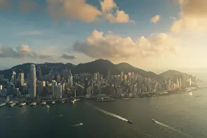 Aerial view of Hong Kong skyline and Victoria Harbor during sunset in Hong Kong. Asia