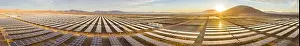 Aerial view of hundreds solar energy panels rows along the dry lands at Atacama Desert