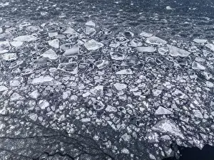 Fragmented Prints: Aerial view of the ice texture broken into pieces of different shapes and sizes