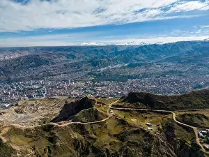 High Lying Prints: Aerial view from the impressive landmark Muela del Diablo over the mountains down into the valley with the cities La