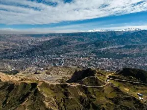 High Lying Prints: Aerial view from the impressive landmark Muela del Diablo over the mountains down into the valley with the cities La