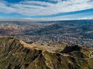 High Lying Prints: Aerial view from the impressive landmark Muela del Diablo over the mountains down into the valley with the cities La