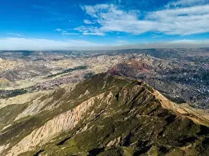 High Lying Prints: Aerial view from the impressive landmark Muela del Diablo over the mountains down into the valley with the cities La