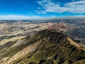 La Paz Prints: Aerial view from the impressive landmark Muela del Diablo over the mountains down into the valley with the cities La