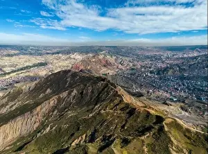 La Paz Prints: Aerial view from the impressive landmark Muela del Diablo over the mountains down into the valley with the cities La