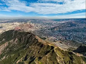 La Paz Prints: Aerial view from the impressive landmark Muela del Diablo over the mountains down into the valley with the cities La