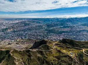 La Paz Prints: Aerial view from the impressive landmark Muela del Diablo over the mountains down into the valley with the cities La