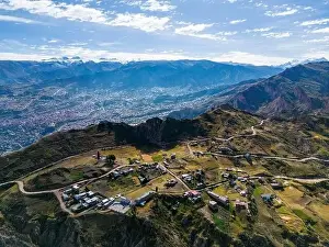 La Paz Prints: Aerial view from the impressive landmark Muela del Diablo over the mountains down into the valley with the cities La