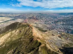 La Paz Prints: Aerial view from the impressive landmark Muela del Diablo over the mountains down into the valley with the cities La