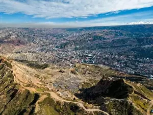 La Paz Prints: Aerial view from the impressive landmark Muela del Diablo over the mountains down into the valley with the cities La