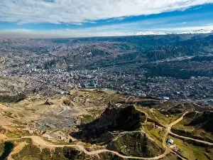 La Paz Prints: Aerial view from the impressive landmark Muela del Diablo over the mountains down into the valley with the cities La
