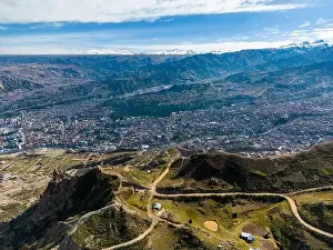 La Paz Prints: Aerial view from the impressive landmark Muela del Diablo over the mountains down into the valley with the cities La