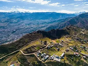 Overland Prints: Aerial view from the impressive landmark Muela del Diablo over the mountains down into the valley with the cities La